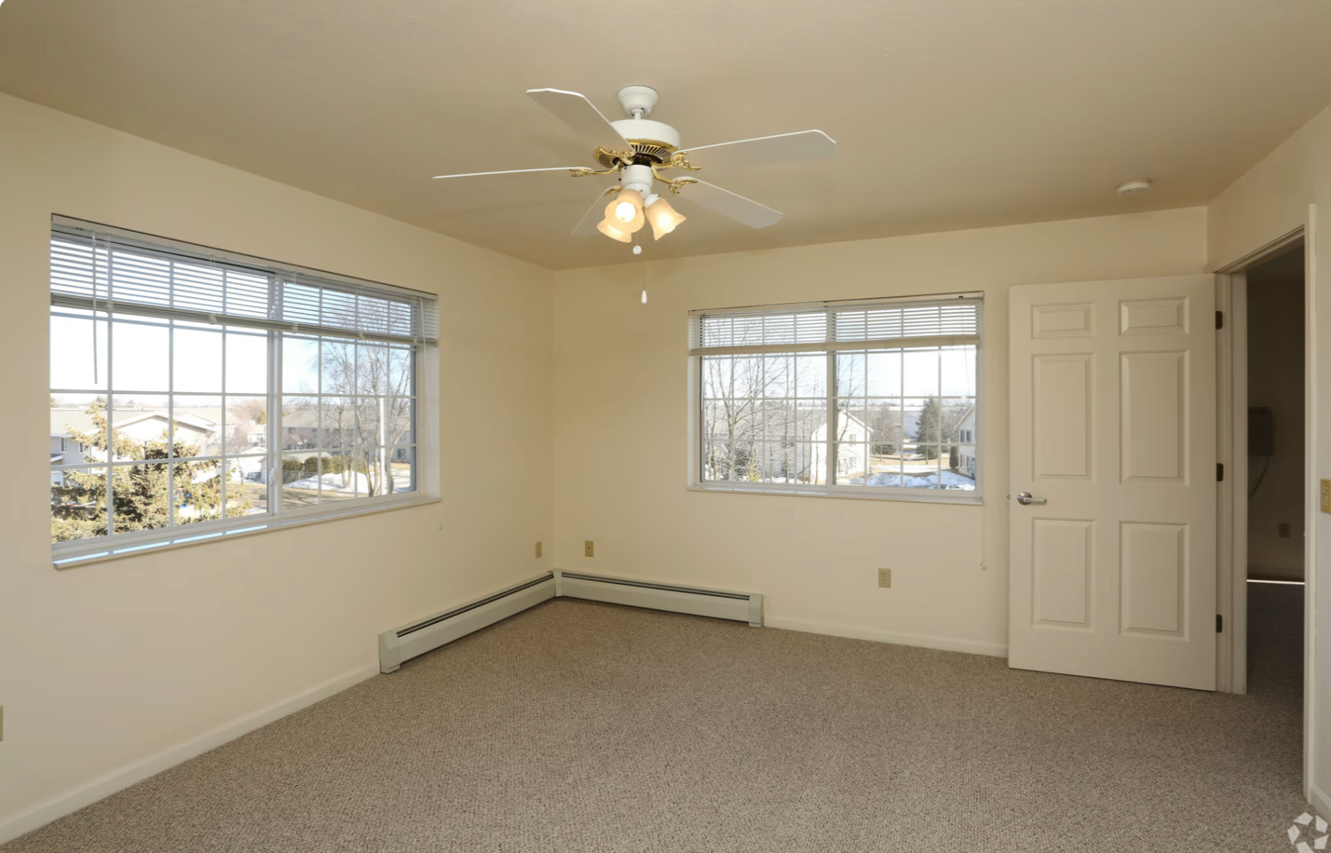 Sunlit bedroom with large windows